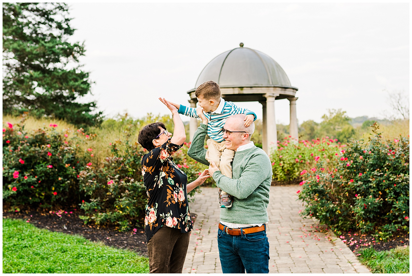 family of 3 giving high fives at glenwood gardens